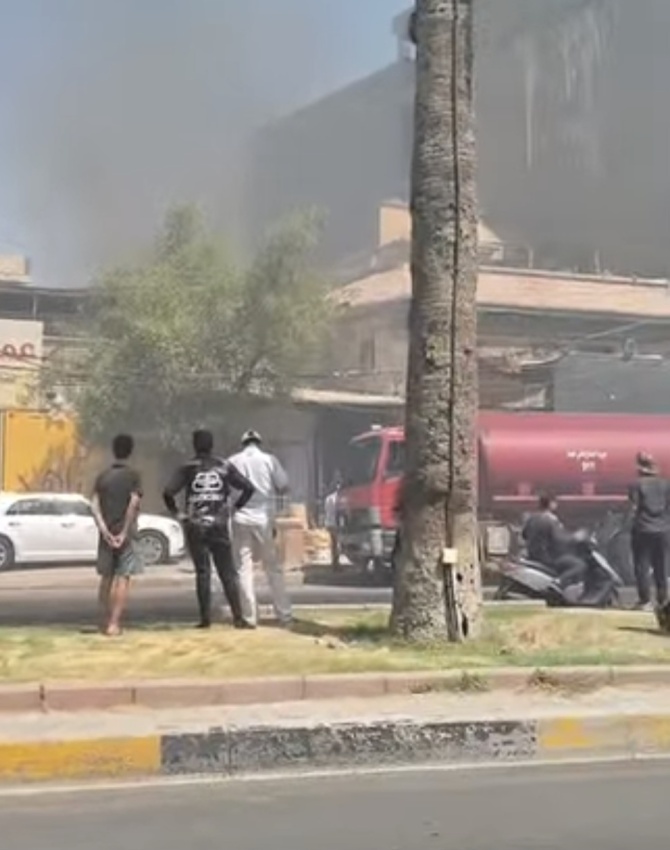 السيطرة على حريق اندلع داخل إحدى البنايات التجارية وسط بغداد